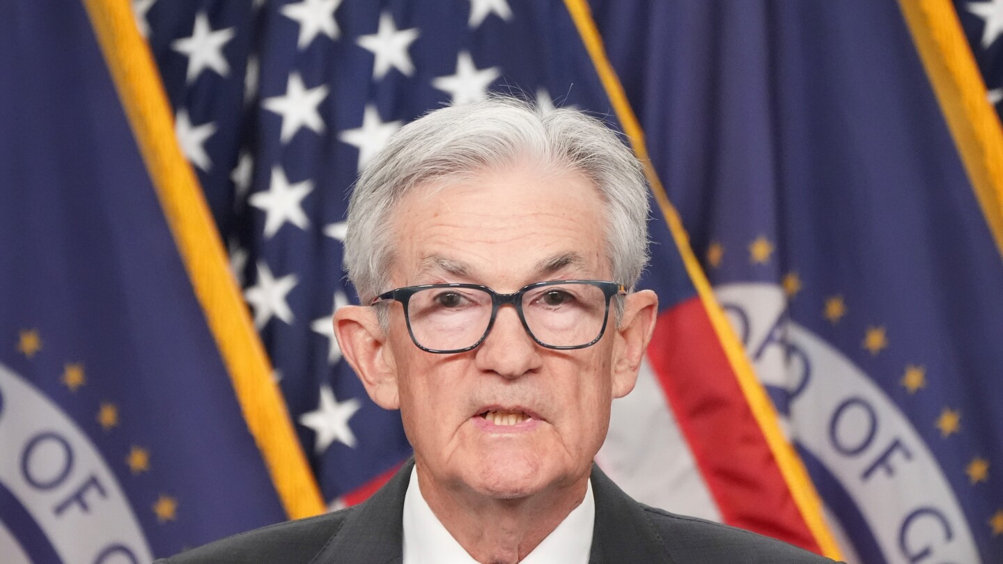 Federal Reserve cuts key rate, sees healthier economy next year