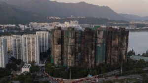 Hong Kong police arrest man for posts about deadly fire