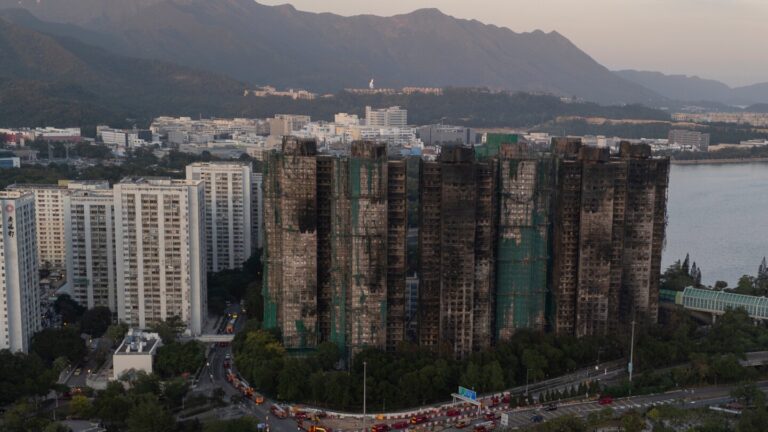 Hong Kong police arrest man for posts about deadly fire