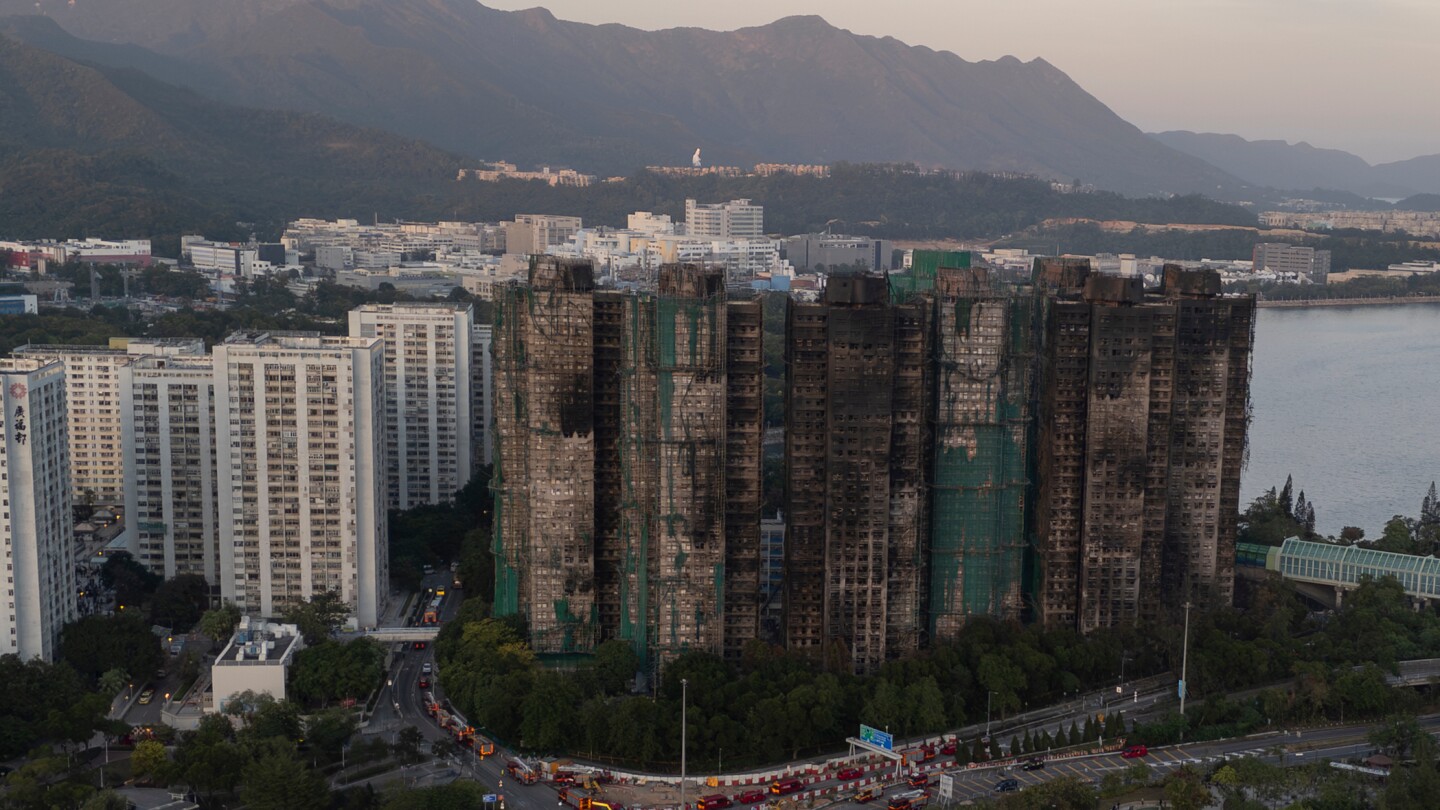 Hong Kong police arrest man for posts about deadly fire