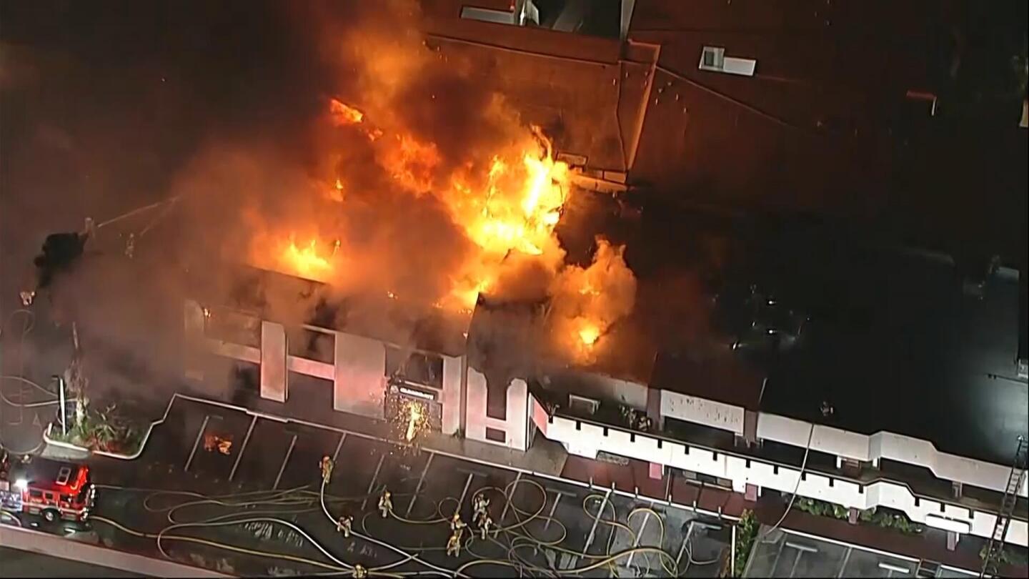 Large building fire in Los Angeles send flames high into the air | AP News
