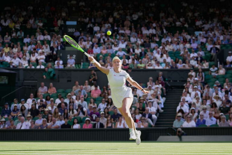 Wimbledon crowd keeps one eye on England's World Cup match